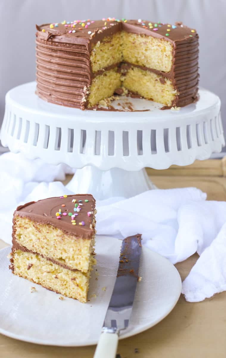 This recipe for moist yellow cake with chocolate buttercream frosting because is easy, beautiful, and an absolute crowd pleaser. Full recipe at femalefoodie.com!