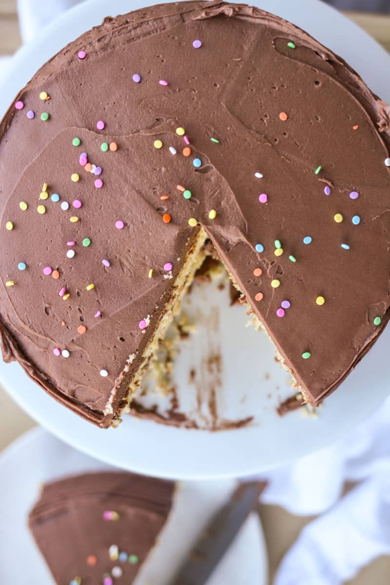 This recipe for moist yellow cake with chocolate buttercream frosting because is easy, beautiful, and an absolute crowd pleaser. Full recipe at femalefoodie.com!