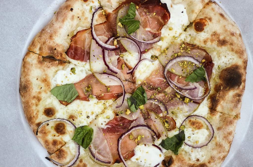 A list of tried and true spots for the best pizza in Salt Lake City. This list of favorites includes pizza for all occasions!