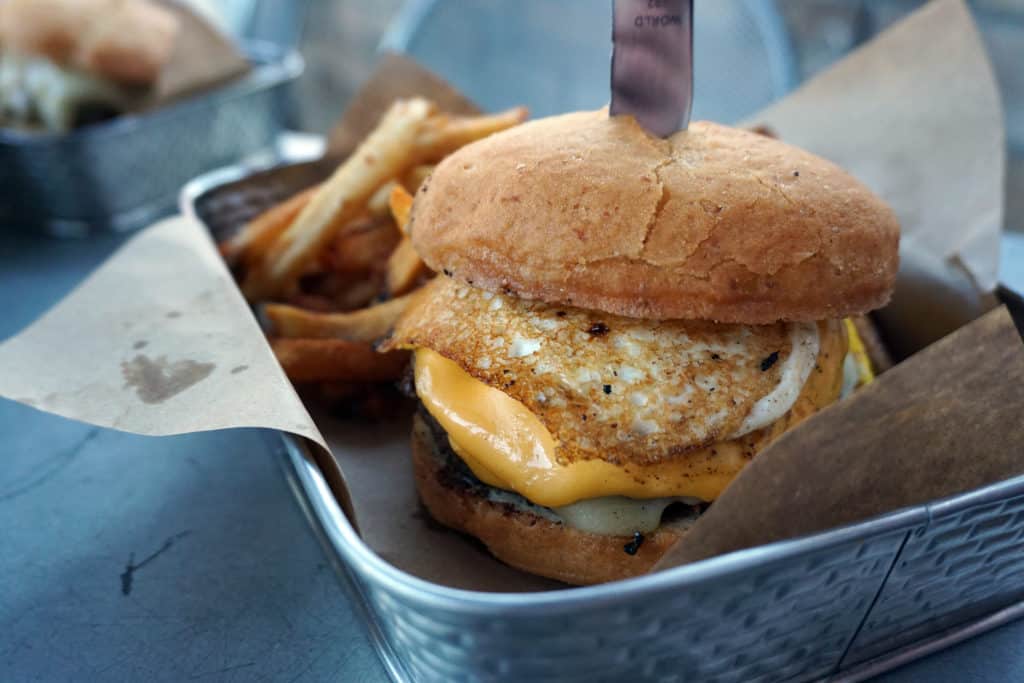 Highlan Tap & Burger is a lively bar and grill serving gourmet burgers and duck fat fries.
