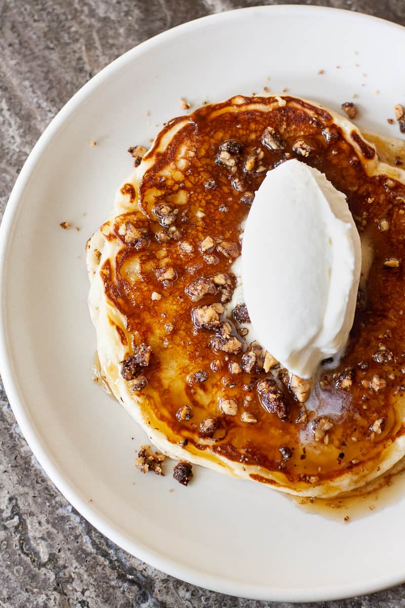 Pancake with caramelized toffee sauce, candied pecan crunch, and whipped crème fraiche by Carpenters Hall