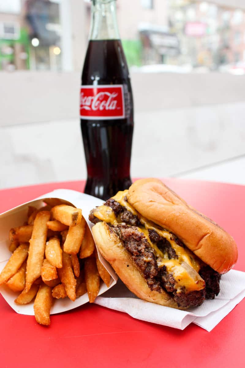 Smashburger with fries and coke by 7th Street Burger 