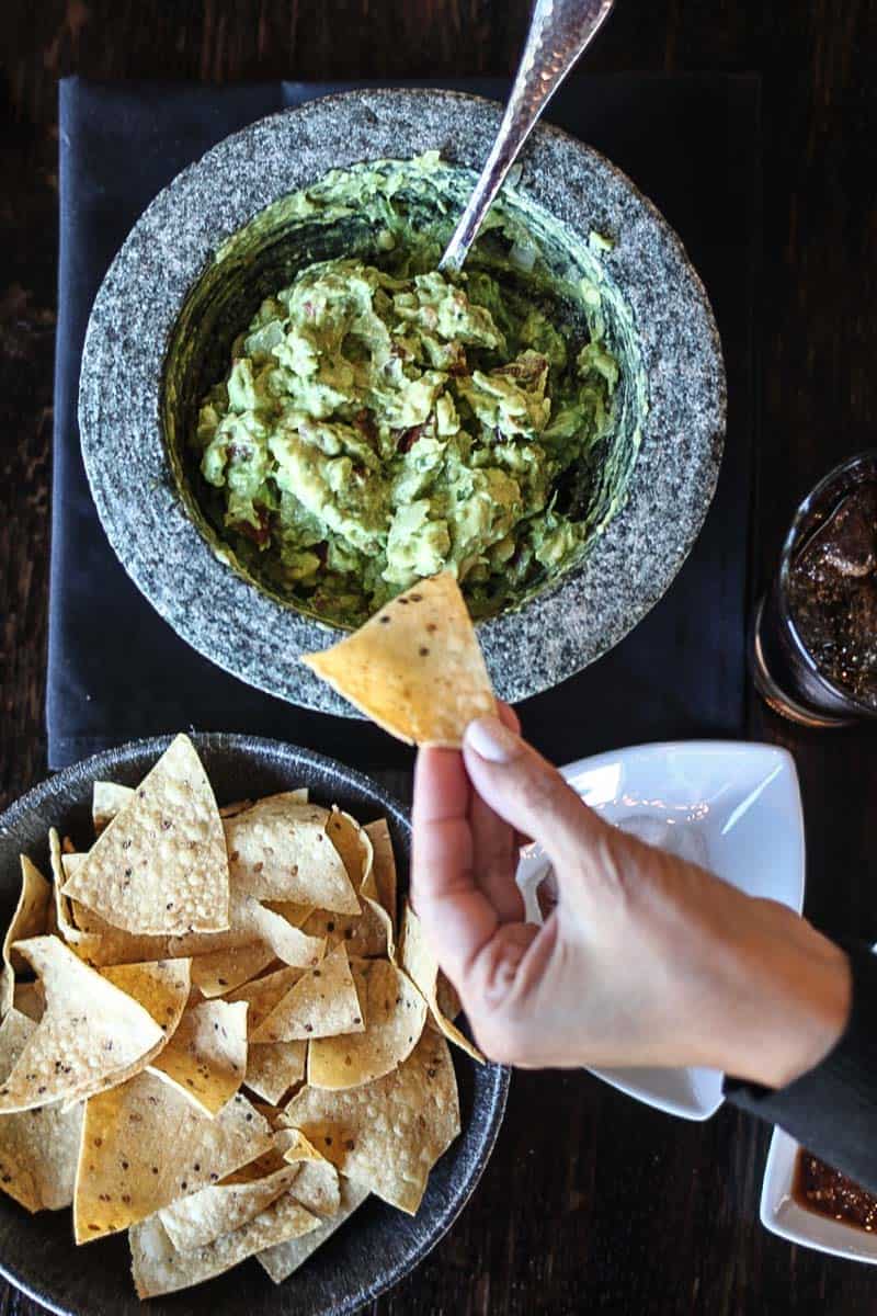 There is regular guacamole, and then there is perfect homemade guacamole with fresh avocados and the perfect amount of onion, cilantro, salt, and tomatoes!