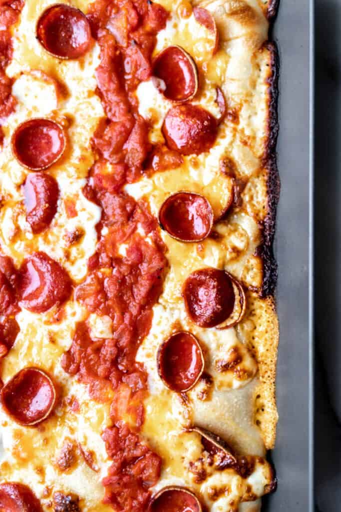 Close up view of Detroit-style pizza with pepperoni
