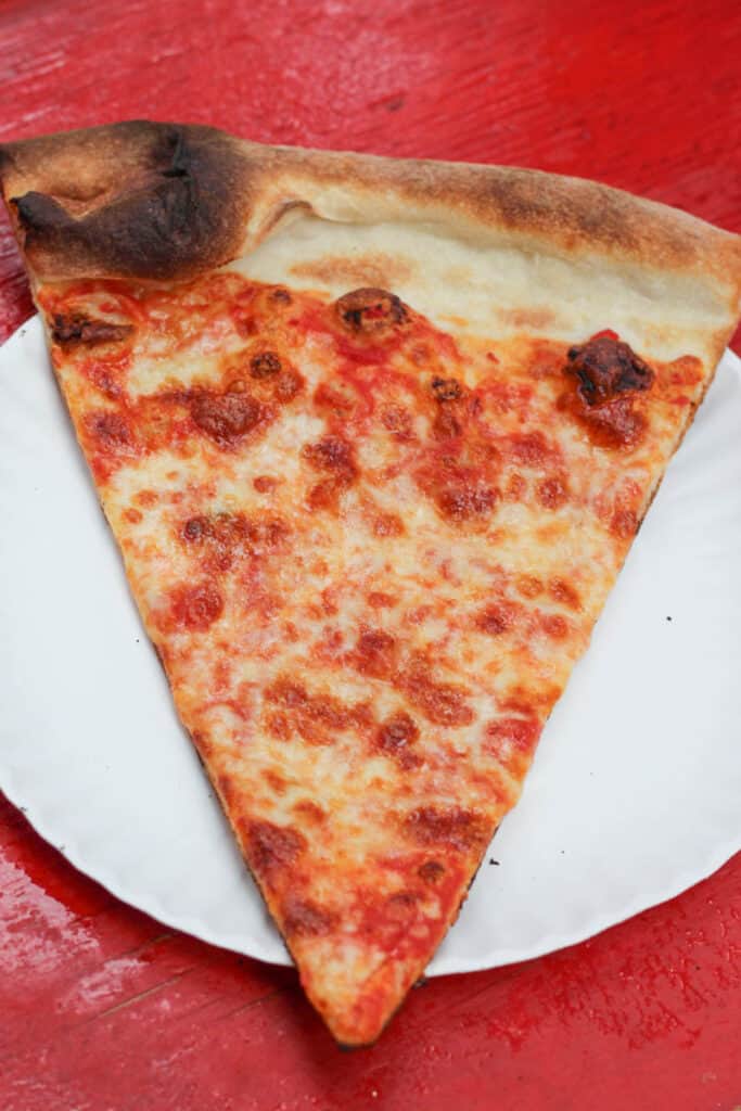 Large, cheesy slice of Joe's Pizza