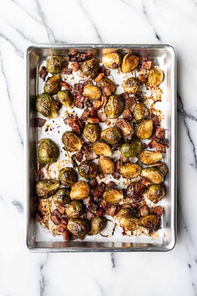 Balsamic Glazed Brussels Sprouts with Bacon on cookie sheet