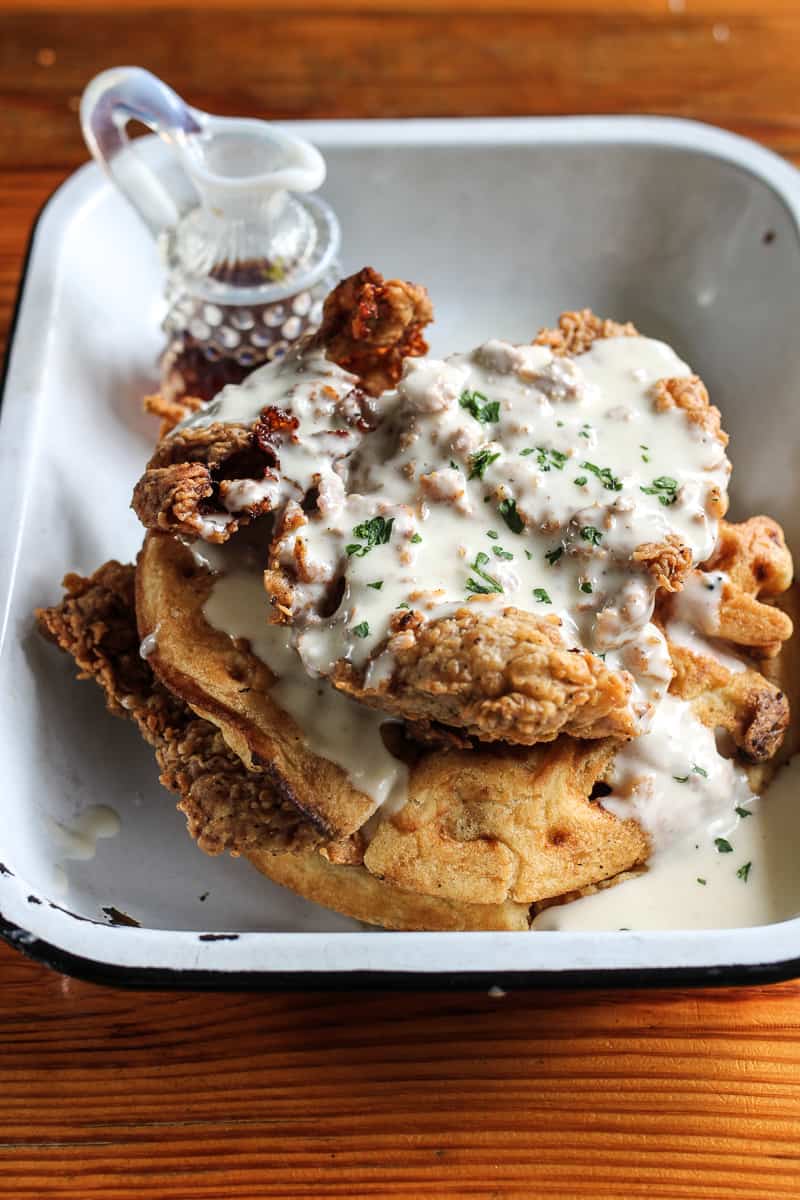 chicken fried steak and waffles with sausage gravy and maple syrup by Jacoby's