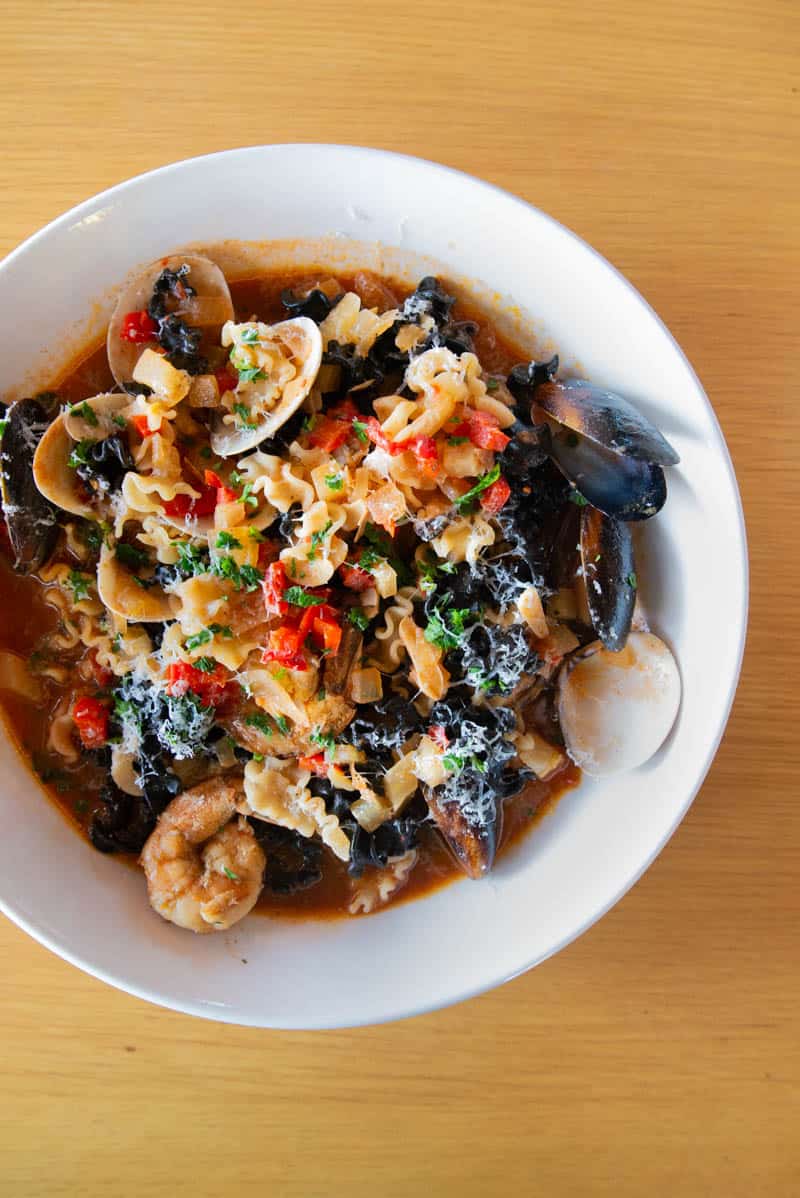 italian restaurants in Phoenix: Campo Italian Bistro's Mafaldini Pescatore squid ink pasta with mussels, clams, and shrimp all covered in a light, broth-like tomato sauce with just a bit of heat