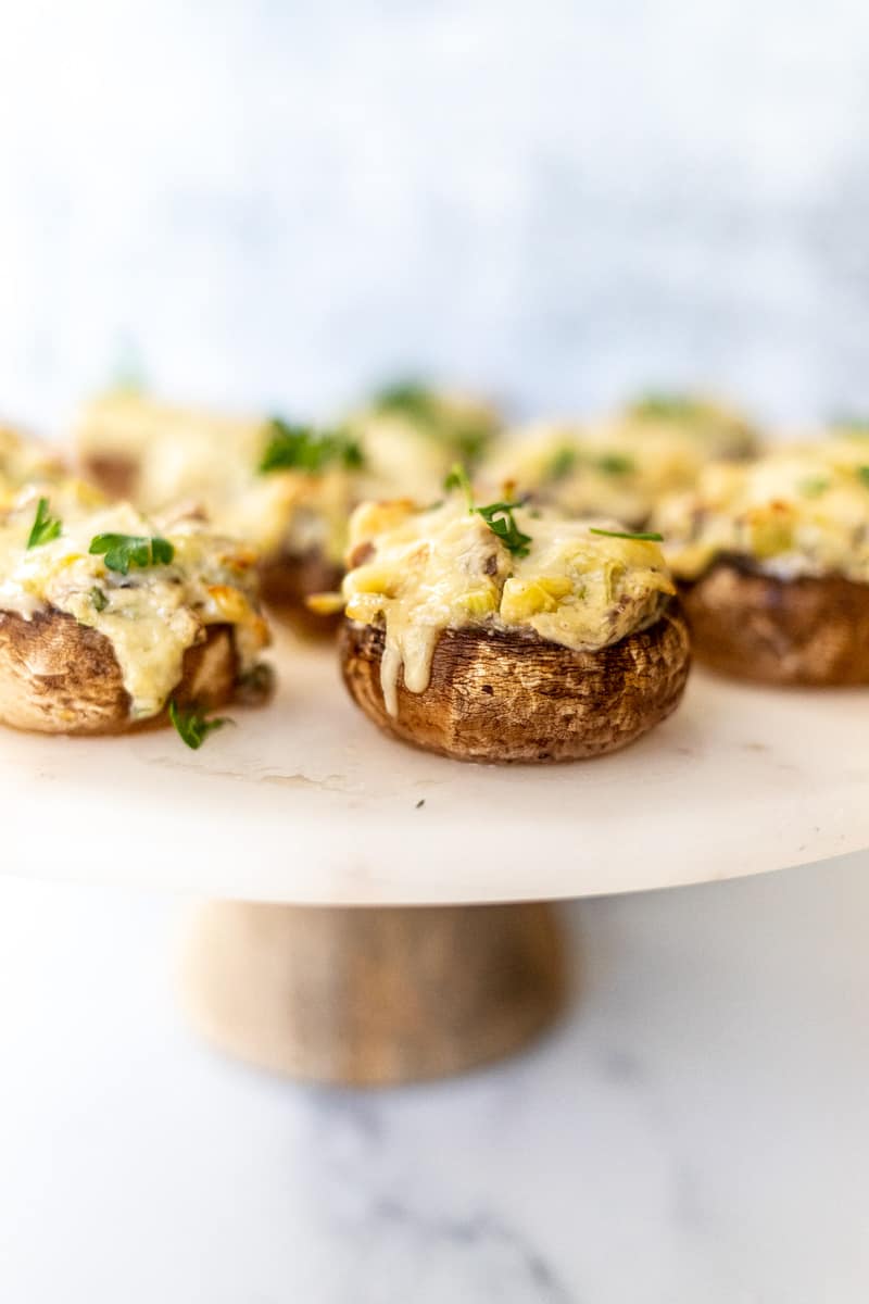 cheese stuffed mushrooms on cake stand