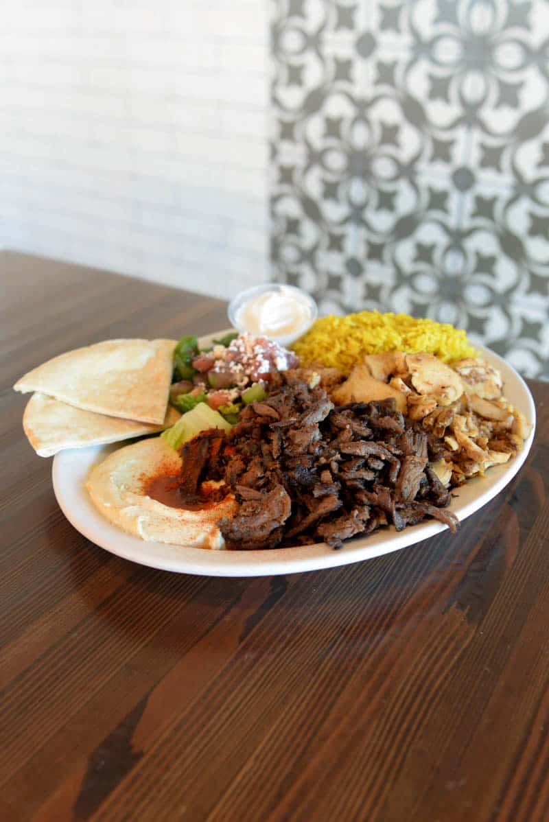 Green Corner's Kababs and each entree comes with a side of yellow rice, pita, greek salad, and hummus.