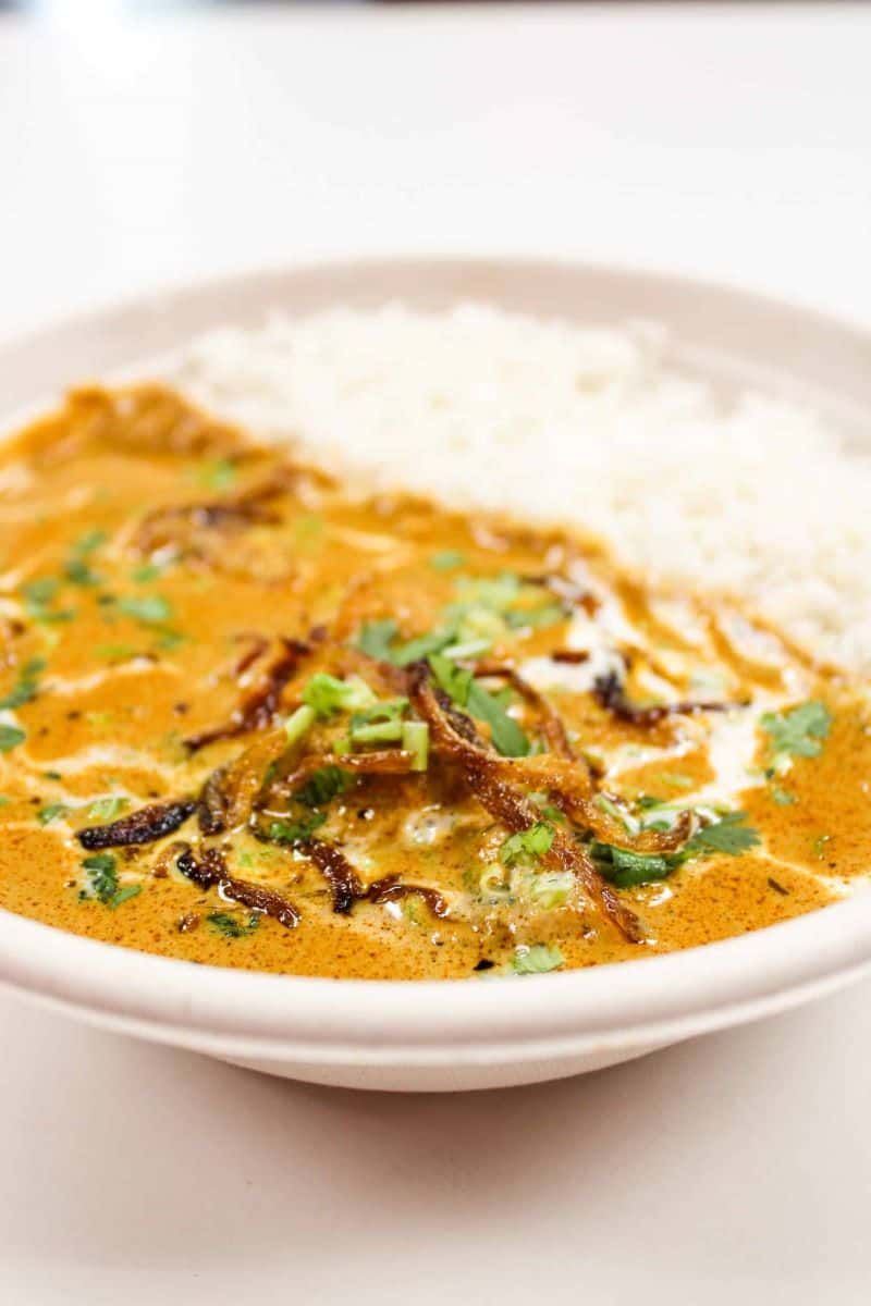 Indian Restaurants in Salt Lake City: Makam's bowl with basmati rice, lamb, coconut korma sauce, and topping it all off with cilantro, fried onions, and fresh cream