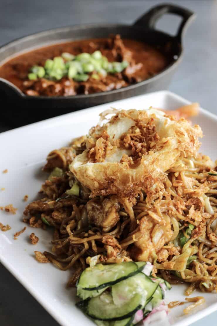 Mie Tek Tek, an Indonesian noodle stir fry that features chicken, vegetables, and a fried egg, in a delicious sweet soy sauce by MakanMakan